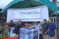 Photo, Partai NasDem Aceh Tenggara Peduli Bencana Melalui Garda Pemuda NasDem Menyerahkan Bantuan Sembako Diposko Relawan Korban Terdampak Banjir Bandang.